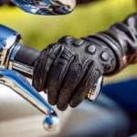 Close-of-of-rider-holding-motorcycle-handle