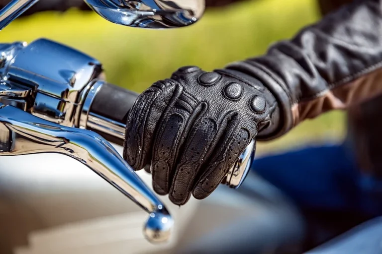 Close-of-of-rider-holding-motorcycle-handle